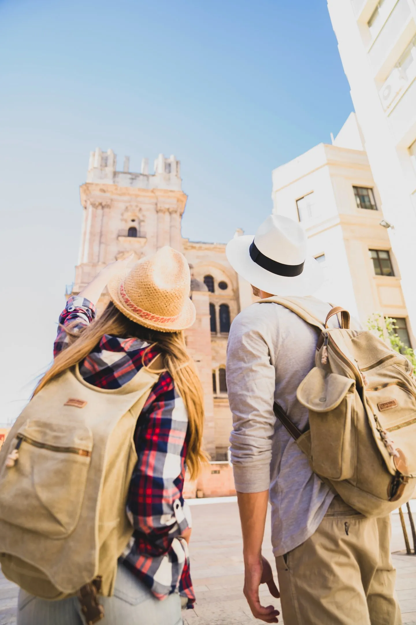 Visitors exploring a European old-town street